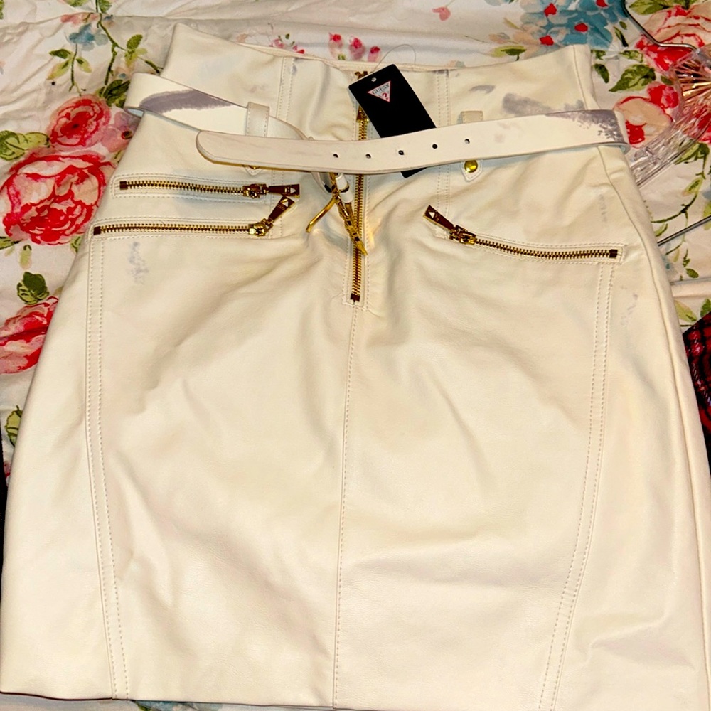 Guess size 4 skirt white leather never worn has stains on sides of skirt. NWT